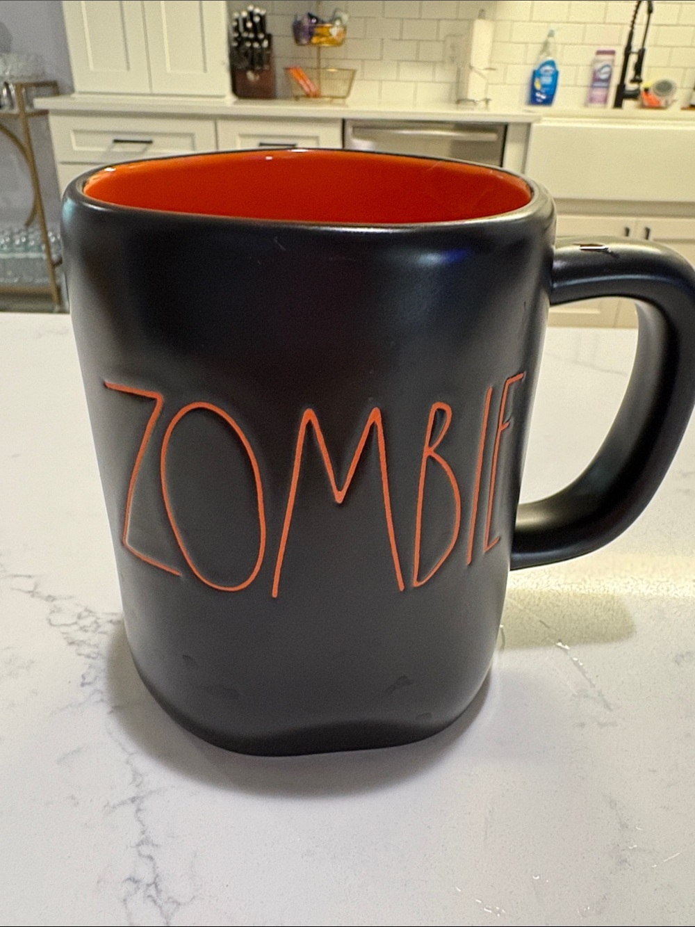 Rae Dunn Black Mug with Orange Interior and Lettering
